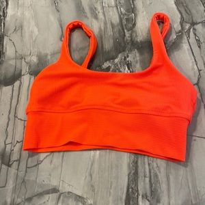 Beach Riot neon orange sports bra